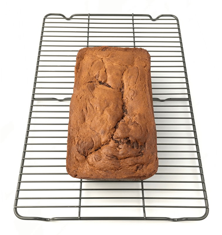 Top view of baked Nutella swirl banana bread loaf on a cooling rack