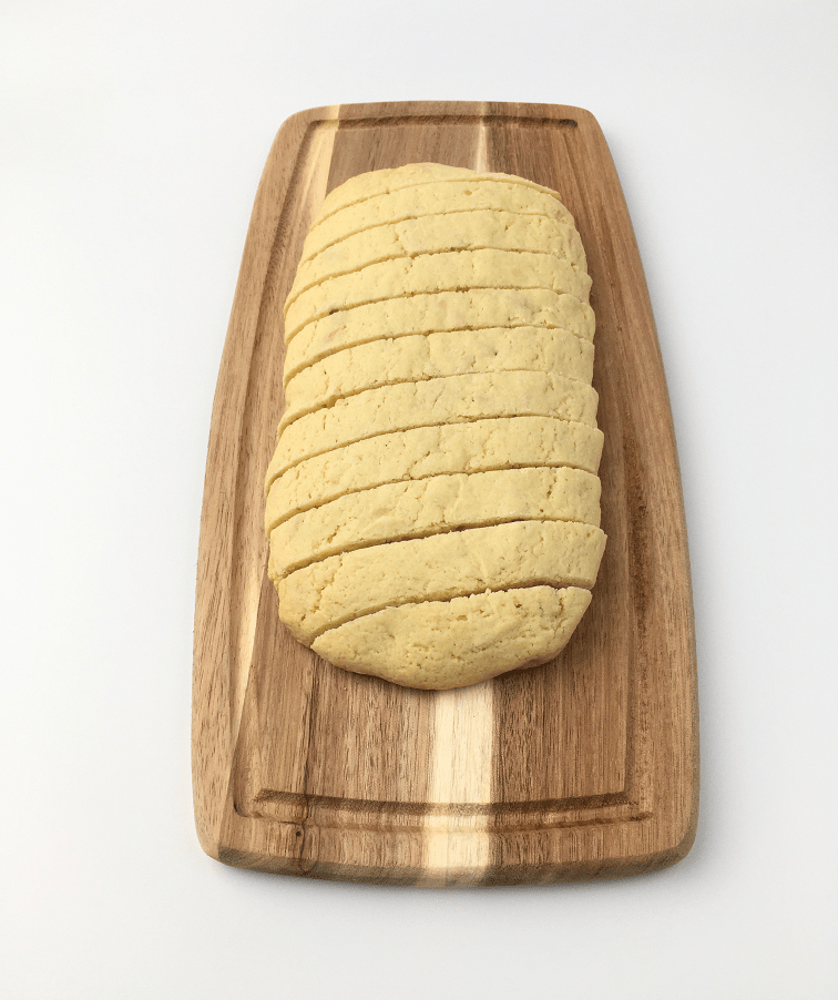 Baked vanilla almond biscotti loaf with diagonal cuts