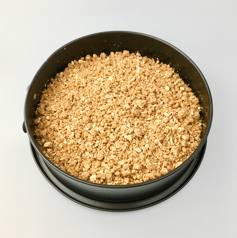 Blueberry muffin batter topped with streusel before baking