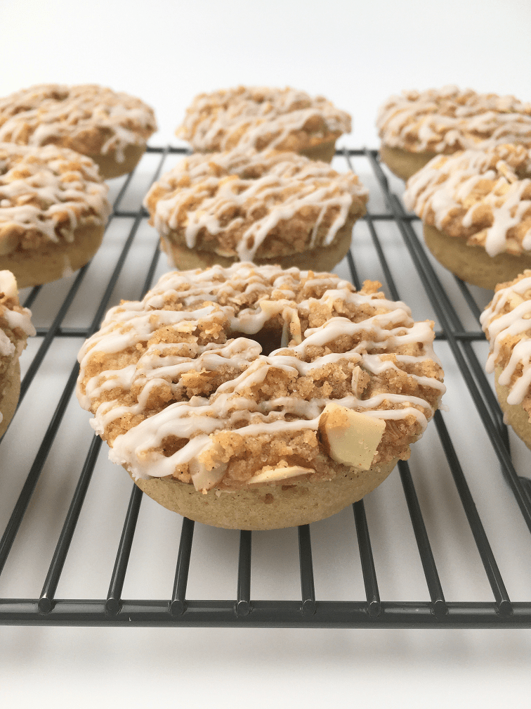 Crumb cake donuts on a cooling rack close up