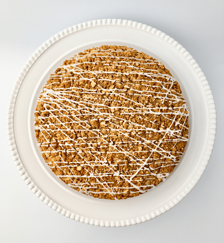 Top view of blueberry streusel muffin cake with powdered sugar glaze