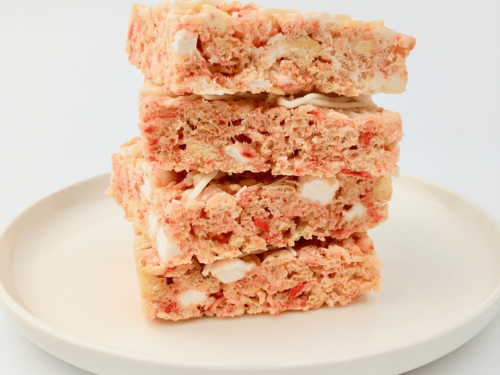 Stack of Strawberry Shortcake Rice Krispies treats on a white plate