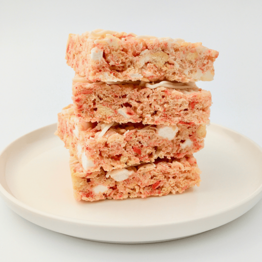 Stack of Strawberry Shortcake Rice Krispies treats on a white plate