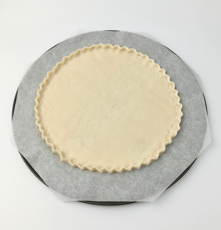 Pie crust dough with fluted edges