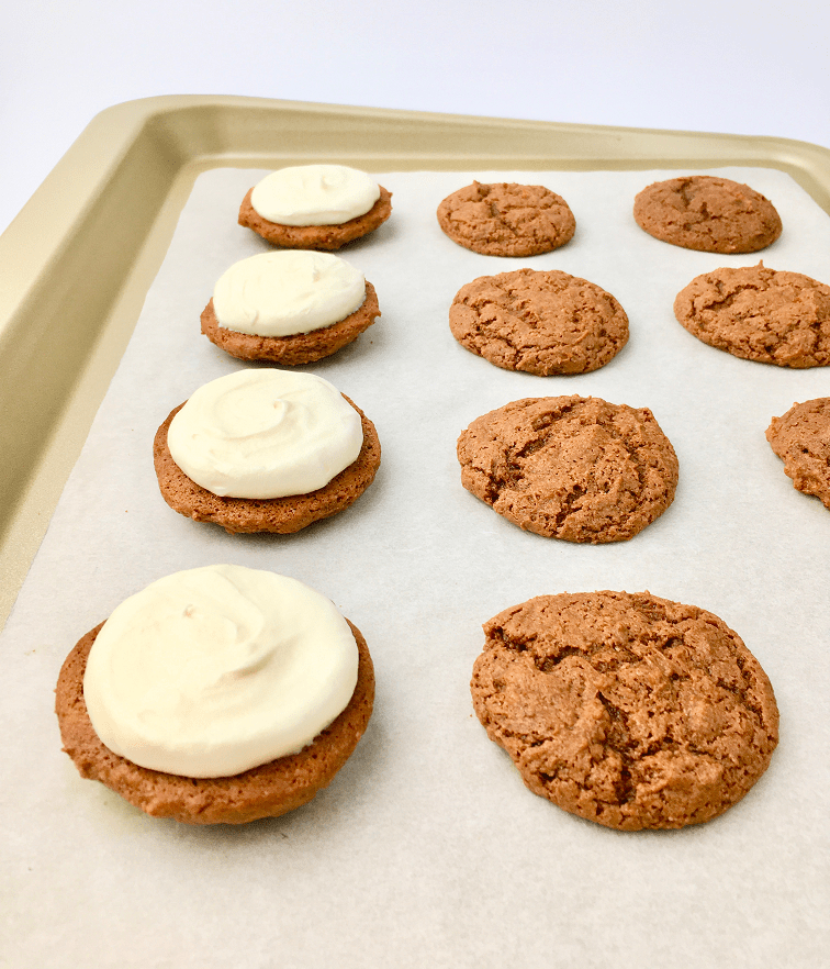 Baked carrot cake cookies topped with cream cheese filling