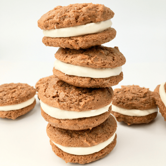 Stack of four carrot cake sandwich cookies