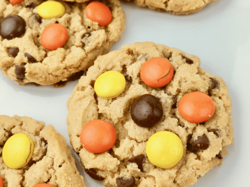 Close up of Reese's pieces peanut butter cookies on a plate