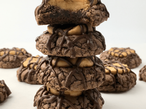 Stack of buckeye cookies surrounded by more buckeye cookies