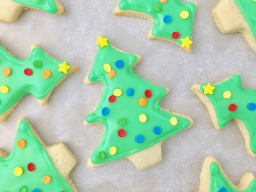 Christmas tree sugar cookies decorated with green icing and sprinkles