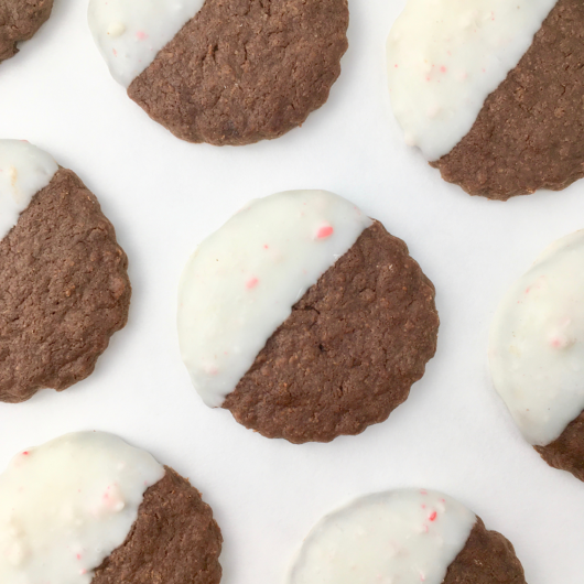 Close up of diagonal rows of peppermint bark shortbread cookies