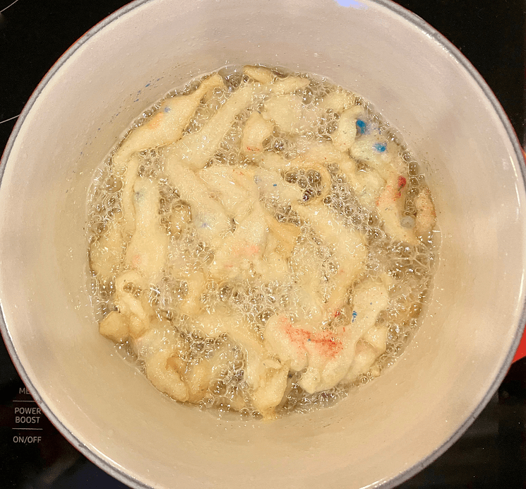 Funfetti funnel cake frying in oil