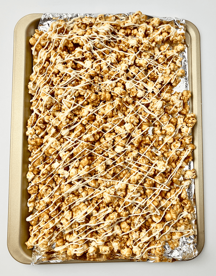 Maple spice caramel corn drizzled with white chocolate.