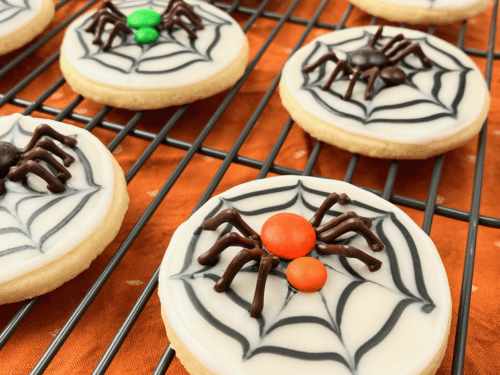 Close up of finished spider web cookie with chocolate spider.