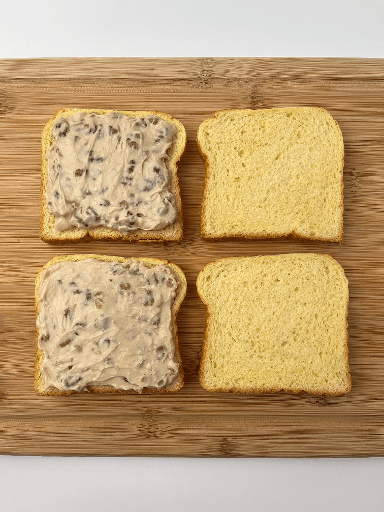 Maple walnut cream cheese spread on half of the brioche slices.