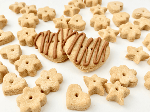 Chicken dog treats shaped into small hearts, stars, and flowers.