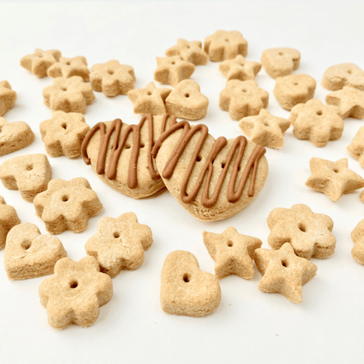 Chicken dog treats shaped into small hearts, stars, and flowers.