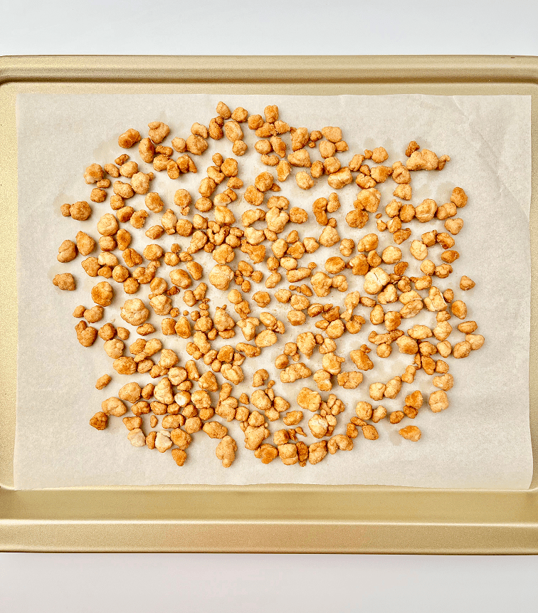 Baked pie crust crunchies on a baking pan.